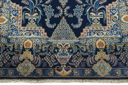 Close-up detail of 2000s Kashan rug from Iran / Persia showing Wool weave
