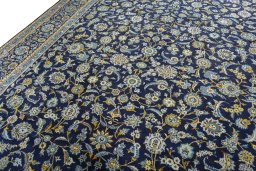Backside of handmade 1970s Kashan rug showing knot structure and weave density