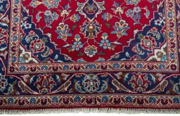 Close-up detail of 2000s Kashan rug from Iran / Persia showing Wool weave