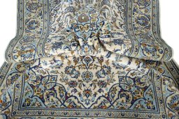 Surface texture of 2000s Kashan rug with natural Wool and intricate pattern