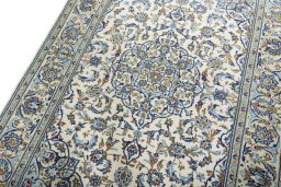Backside of handmade 2000s Kashan rug showing knot structure and weave density