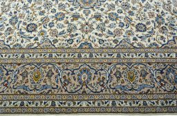 Corner detail of 2000s Kashan rug showing border pattern and Wool pile