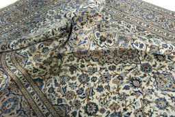 Surface texture of 2000s Kashan rug with natural Wool and intricate pattern