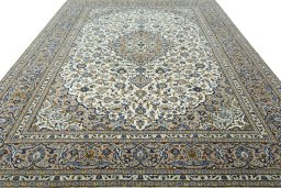 Surface texture of 2000s Kashan rug with natural Wool and intricate pattern