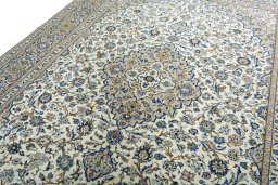 Backside of handmade 2000s Kashan rug showing knot structure and weave density