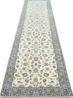 Surface texture of 2000s Kashan rug with natural Wool and intricate pattern