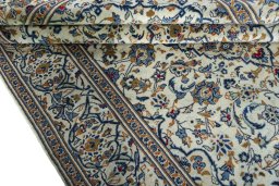 Close-up detail of 2000s Kashan rug from Iran / Persia showing Wool weave