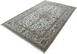Corner detail of 2000s Kashan rug showing border pattern and Wool pile