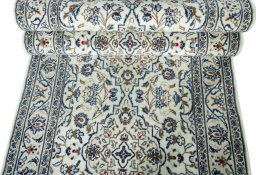 Corner detail of New Kashan rug showing border pattern and Wool pile