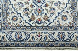 Close-up detail of New Kashan rug from Iran / Persia showing Wool weave