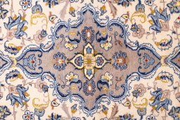 Corner detail of 1980s Kashan rug showing border pattern and Wool pile