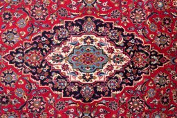 Close-up detail of 1975s Kashan rug from Iran / Persia showing Wool weave