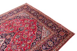 Backside of handmade 1975s Kashan rug showing knot structure and weave density