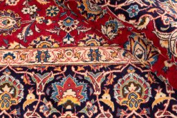Close-up detail of 1974s Kashan rug from Iran / Persia showing Wool weave