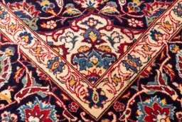 Close-up detail of 1974s Kashan rug from Iran / Persia showing Wool weave