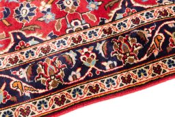 Backside of handmade 1999s Kashan rug showing knot structure and weave density