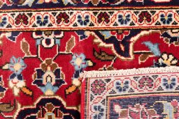 Close-up detail of 1999s Kashan rug from Iran / Persia showing Wool weave