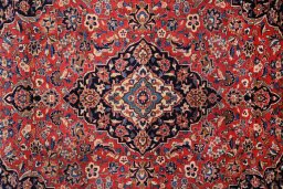 Corner detail of 1980s Kashan rug showing border pattern and Wool pile