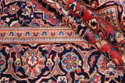 Close-up detail of 1980s Kashan rug from Iran / Persia showing Wool weave