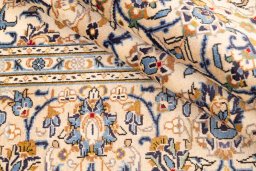 Close-up detail of 1984s Kashan rug from Iran / Persia showing Wool weave