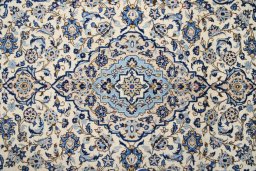 Corner detail of 1990s Kashan rug showing border pattern and Wool pile