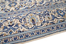 Backside of handmade 1990s Kashan rug showing knot structure and weave density