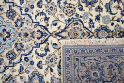 Full view of 1990s Kashan rug from Iran / Persia, 295 × 195 cm in Cream tones