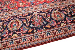 Backside of handmade 1990s Kashan rug showing knot structure and weave density
