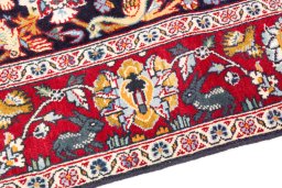 Backside of handmade 2000s Kashan rug showing knot structure and weave density