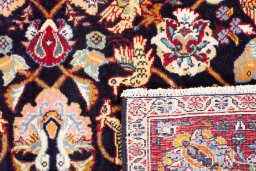 Close-up detail of 2000s Kashan rug from Iran / Persia showing Wool weave