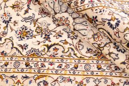 Close-up detail of 1988s Kashan rug from Iran / Persia showing Wool weave