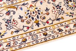 Backside of handmade 1988s Kashan rug showing knot structure and weave density