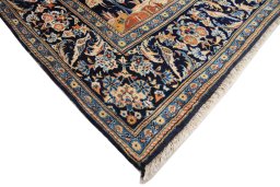 Backside of handmade 1970s Kashan rug showing knot structure and weave density