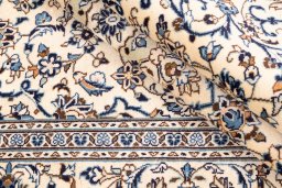 Surface texture of 2000s Kashan rug with natural Wool and intricate pattern
