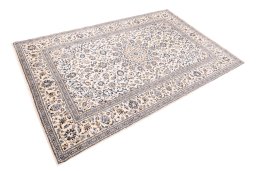 Corner detail of 2000s Kashan rug showing border pattern and Wool pile