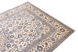 Backside of handmade 2000s Kashan rug showing knot structure and weave density
