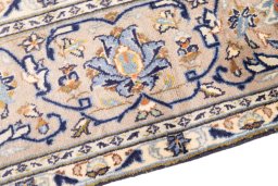 Backside of handmade 1985s Kashan rug showing knot structure and weave density