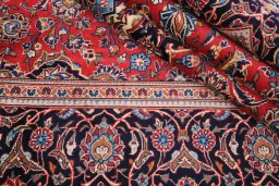 Close-up detail of 2000s Kashan rug from Iran / Persia showing Wool weave