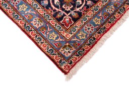 Backside of handmade 1980s Kashan rug showing knot structure and weave density