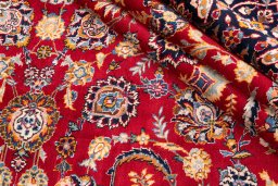 Corner detail of 1980s Kashan rug showing border pattern and Wool pile