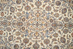 Corner detail of 2000s Kashan rug showing border pattern and Wool pile