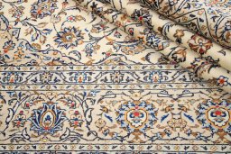 Close-up detail of 2000s Kashan rug from Iran / Persia showing Wool weave