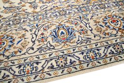 Backside of handmade 2000s Kashan rug showing knot structure and weave density
