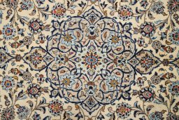 Corner detail of 2000s Kashan rug showing border pattern and Wool pile