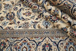 Close-up detail of 2000s Kashan rug from Iran / Persia showing Wool weave