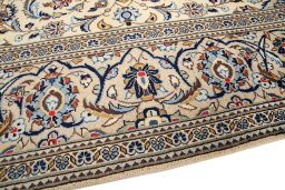 Backside of handmade 2000s Kashan rug showing knot structure and weave density