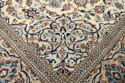 Full view of 2000s Kashan rug from Iran / Persia, 307 × 196 cm in Cream tones