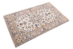 Corner detail of 2000s Kashan rug showing border pattern and Wool pile