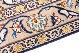 Backside of handmade 2000s Kashan rug showing knot structure and weave density