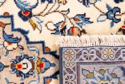 Close-up detail of 2000s Kashan rug from Iran / Persia showing Wool weave